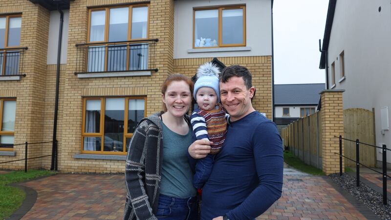 Colm and Jane Ward with their baby Darragh outside their new home in Drogheda. Photograph: Dara Mac Dónaill