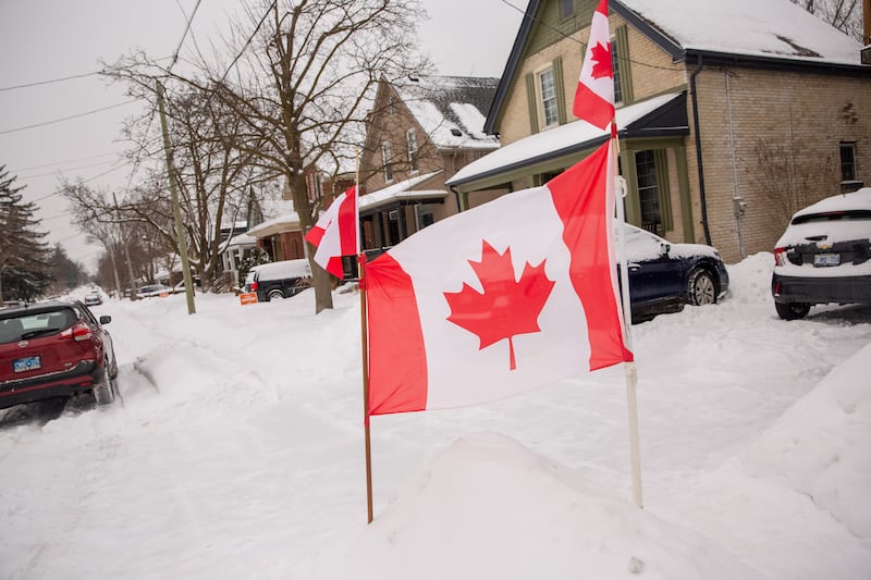 A Canadian flag in front of a home on February 15th, national flag day, in London, Ontario. Photograph: Brett Gundlock/Bloomberg