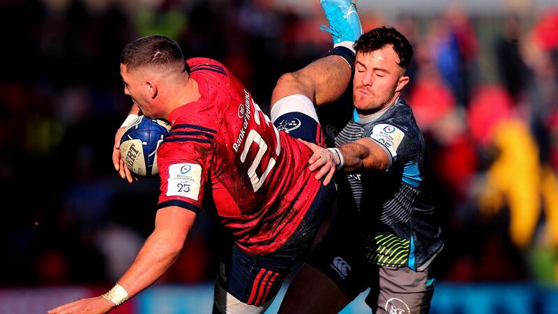 Dan Goggin is tackled by Luke Morgan. Photo: Ryan Byrne/Inpho