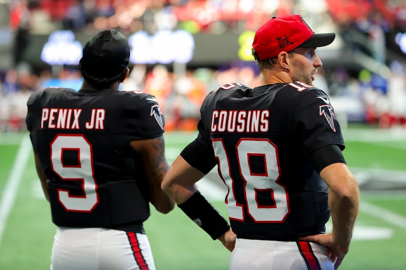 Michael Penix Jr and Kirk Cousins on the sideline during the fourth quarter of the Atlanta Falcons' game against the New York Giants at Mercedes-Benz Stadium in Atlanta, Georgia. Photograph: Kevin C Cox/Getty Images