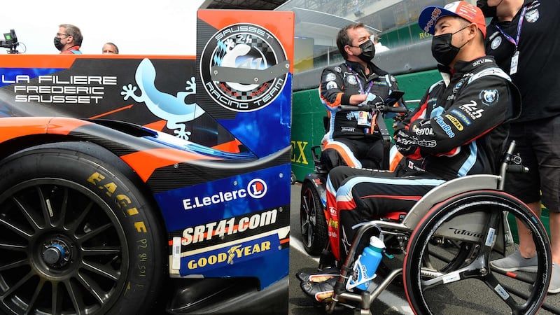 Japanese driver Takuma Aoki (R) and French driver and Team manager Fredric Sausset (L) wait in the grid ahead of their day of racing. Photograph via Getty Images