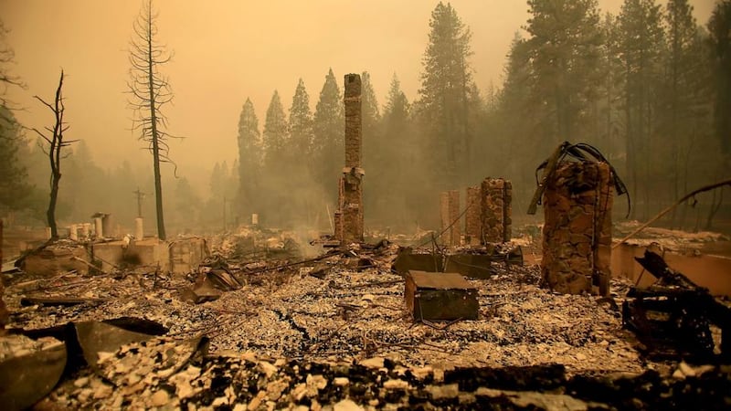 Wildfire spread over the weekend, propelled by strong winds and forcing the evacuations of thousands of people. Photograph: Kent Porter/EPA