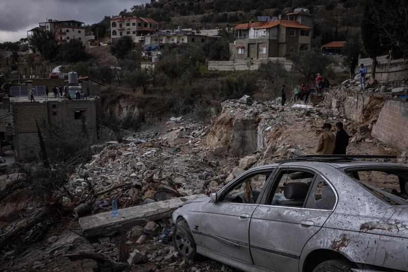 People look out over rubble where an Israeli air strike hit in Ain Yaaqoub, Lebanon, on Tuesday. Photograph: Ed Ram/Getty Images