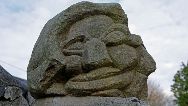 A stone carving called ‘Haha’ at the gate, which was made by Walshe’s father, Denis Mason Jones. Photograph Nick Bradshaw