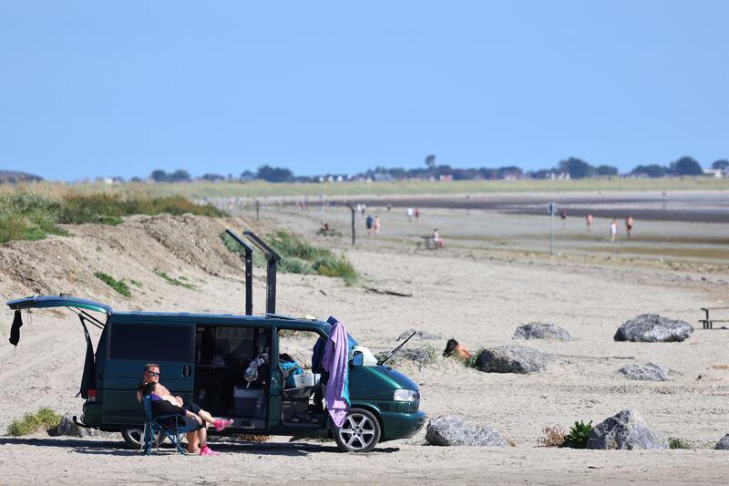 People make for the beach in Dollymount, Dublin, as warm weather arrives. Photograph: Dara Mac Dónaill / The Irish Times








Photograph: Dara Mac Donaill / The Irish Times