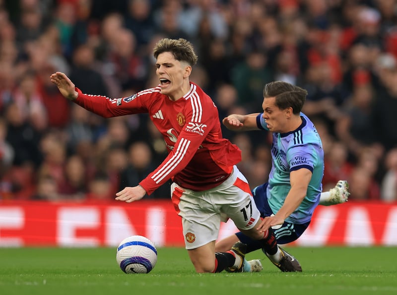 Alejandro Garnacho is fouled by Arsenal's Leandro Trossard. Photograph: Carl Recine/Getty Images