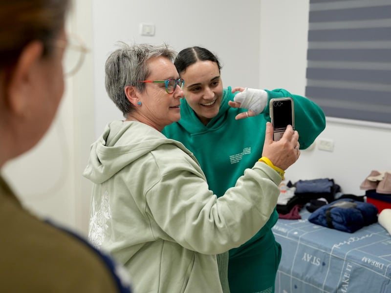 Handout photo issued by the Israeli government of Emily Damari reuniting with her mother Mandy Damari in Israel after being held in captivity for more than 15 months. 
