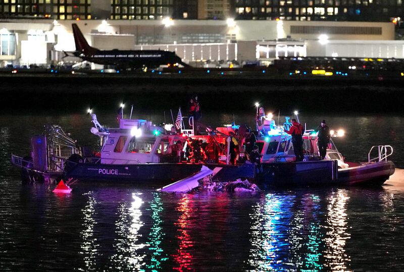 Emergency divers respond after a passenger aircraft collided with a helicopter, in the Potomac River near Ronald Reagan Washington Airport. Photograph: Andrew Harnik/Getty Images