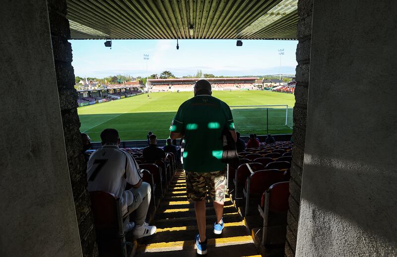 A fan makes his way to his seat at Turner's Cross before a Cork City match. Photograph: Bryan Keane/Inpho