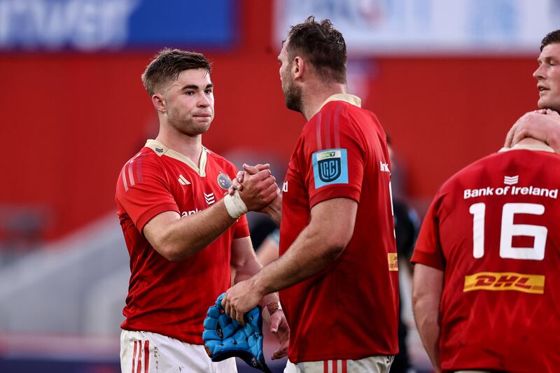 Munster's Jack Crowley after the final whistle with Tadhg Beirne. Photograph: Ben Brady/Inpho