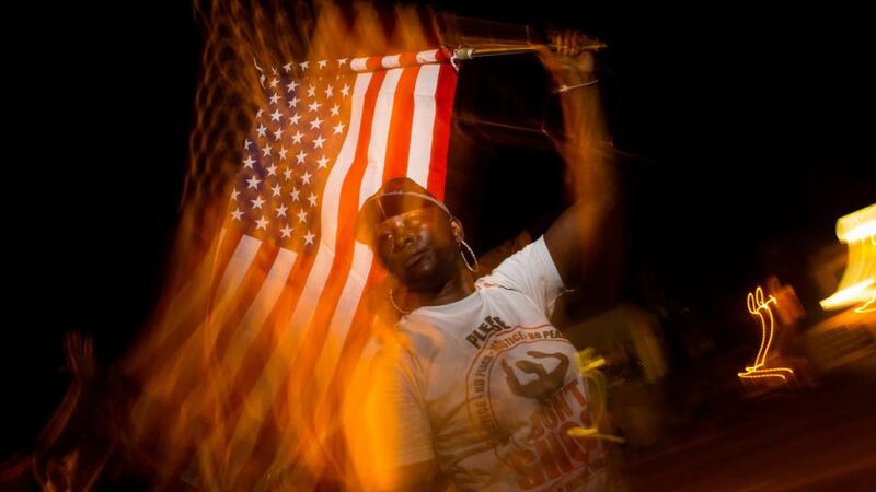 A protester in Ferguson, Missouri on Thursday night.  Photograph: Eric Thayer/The New York Times