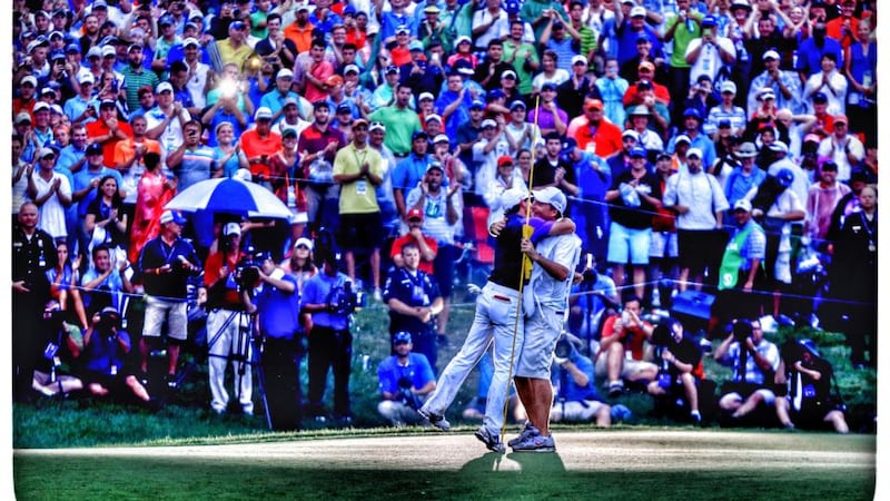 Rory McIlroy celebrates his one-stroke victory on the 18th with his caddie JP Fitzgerald during the final round of the 96th PGA Championship at Valhalla Golf Club. Photograph: David Cannon/Getty Images