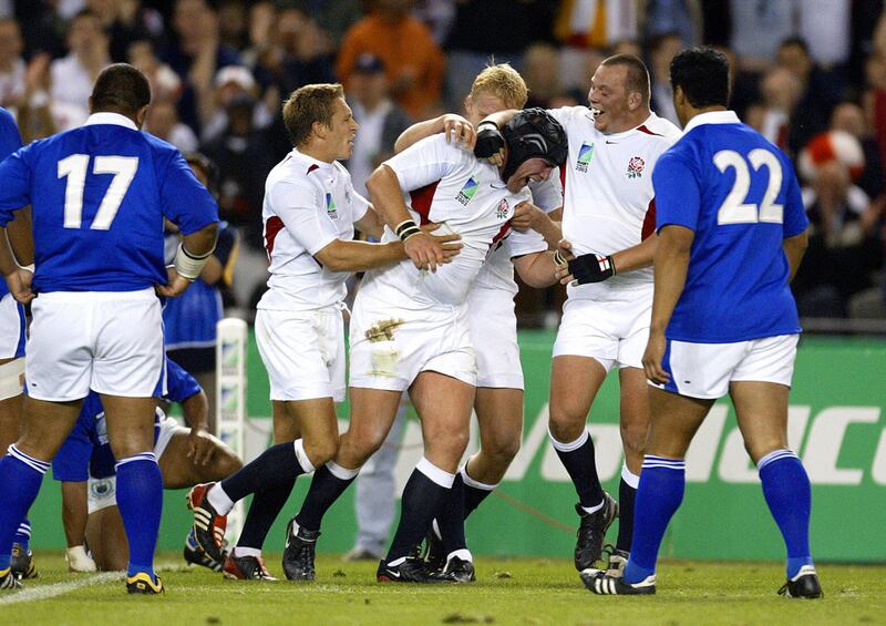 England's prop Phil Vickery is congratulated by his team-mates Jonny Wilkinson  and hooker Steve Thompson after scoring a try against Samoa in the 2003 World Cup. Photograph: Greg Wood/AFP