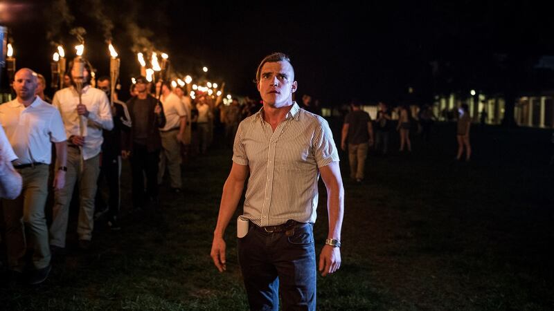 Torch-bearing white nationalists rally around a statue of Robert E Lee in Charlottesville. Photograph: Edu Bayer/The New York Times