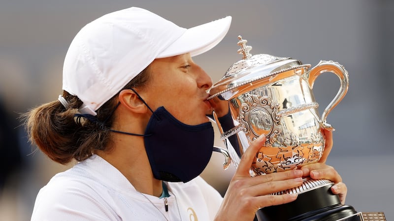 Iga Swiatek kisses the Suzanne-Lenglen cup following victory in  Paris. Photograph: Clive Brunskill/Getty Images