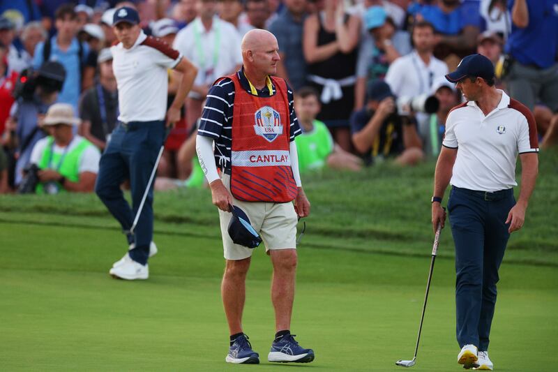 Joe LaCava, Patrick Cantlay's caddie, confronts Rory McIlroy of Team Europe on the 18th green during the Saturday afternoon fourball matches at the Ryder Cup at Marco Simone Golf Club in Rome, Italy. Photograph: Andrew Redington/Getty Images