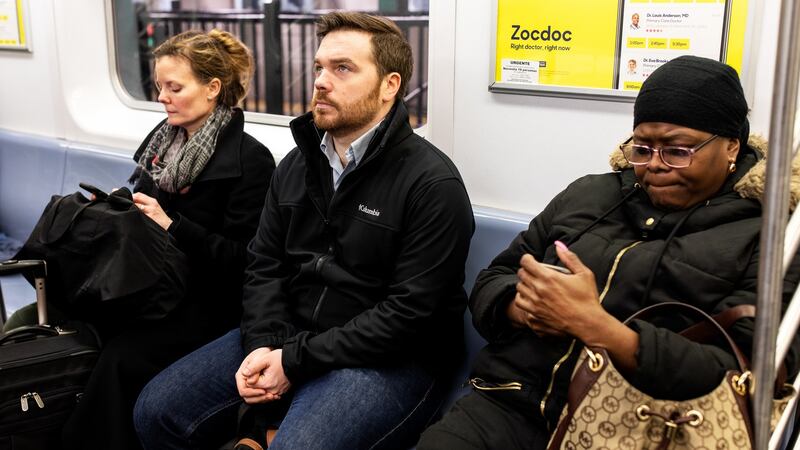 Kevin Roose  rides the subway in New York during a 30-day smartphone detox. Photograph: Demetrius Freeman/The New York Times