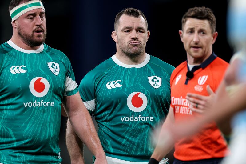 Ireland's Rob Herring and Cian Healy with match referee Paul Williams. Photograph: Billy Stickland/Inpho