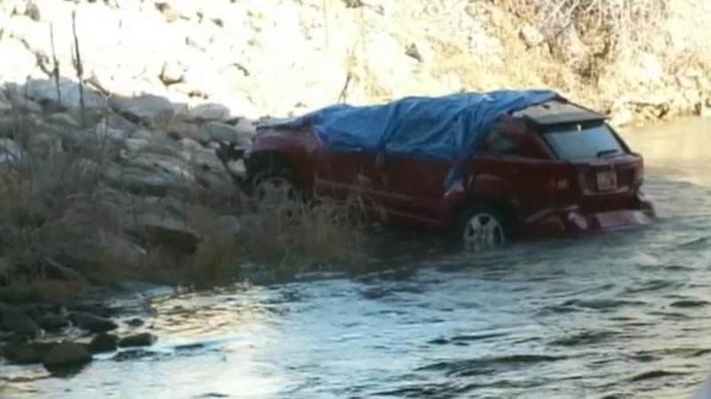 A spokesman said a fisherman discovered the car on its roof at about 12.30pm on Saturday in the Spanish Fork River in Spanish Fork near Provo in Utah. Photograph: Screengrab from Reuters video