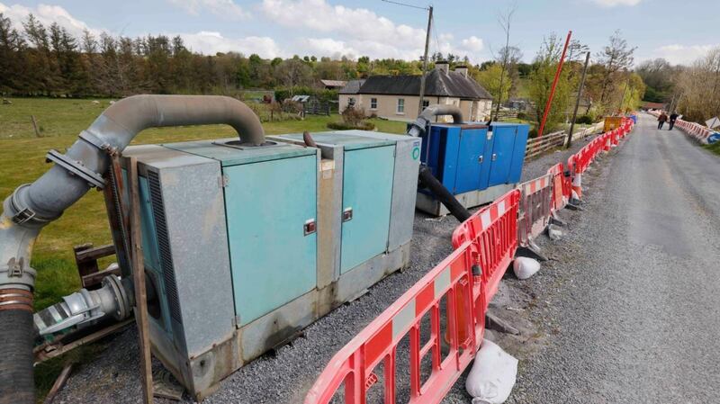 Water pumps near the rising floodwater at Lough Funshinagh in Co Roscommon. Photograph: Alan Betson