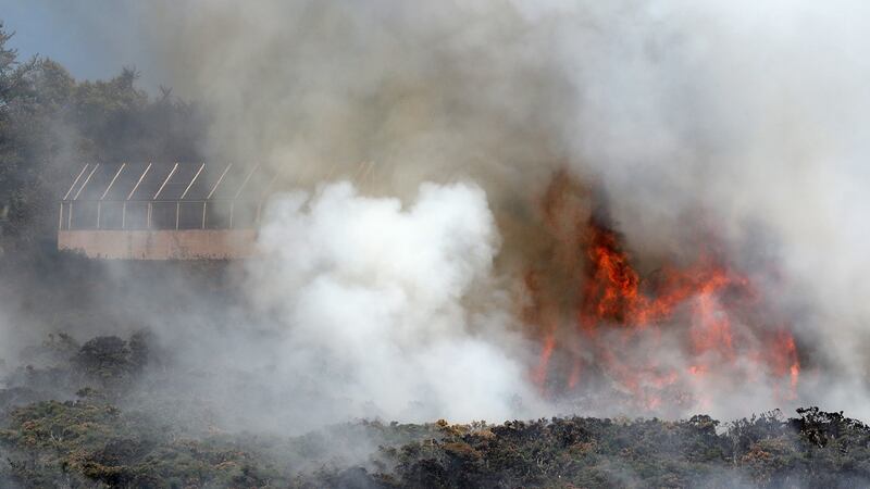 Firefighters battle a gorse fire at Howth Head in Dublin this weekend as the hot weather. Photograph: Niall Carson/PA Wire