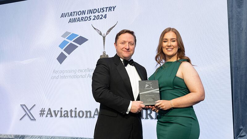 Wayne Tyrell, awards judge, presents the aviation rising star award to Christen Grant, Eirtrade Aviation