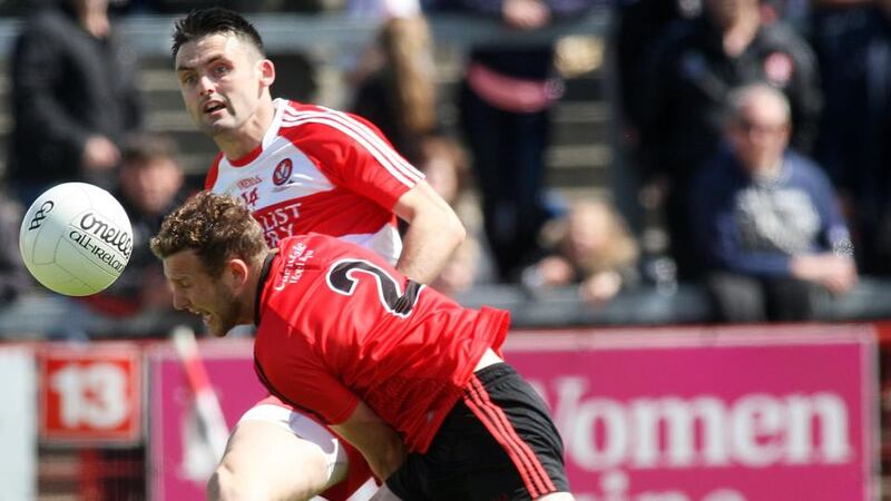 Derry forward Eoin Bradley in action against Down’s Darren O’Hagan during the Ulster SFC quarter-final   at Celtic Park. Photo: Lorcan Doherty/Inpho/Presseye