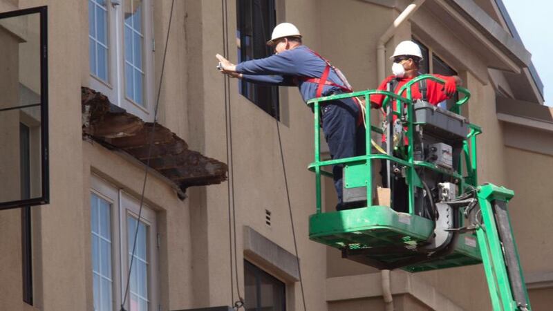 Inspectors photographing the fourth-floor balcony that collapsed in Berkeley, California, which killed six people and injured seven more, last week. Photograph: Peter Dasilva/EPA