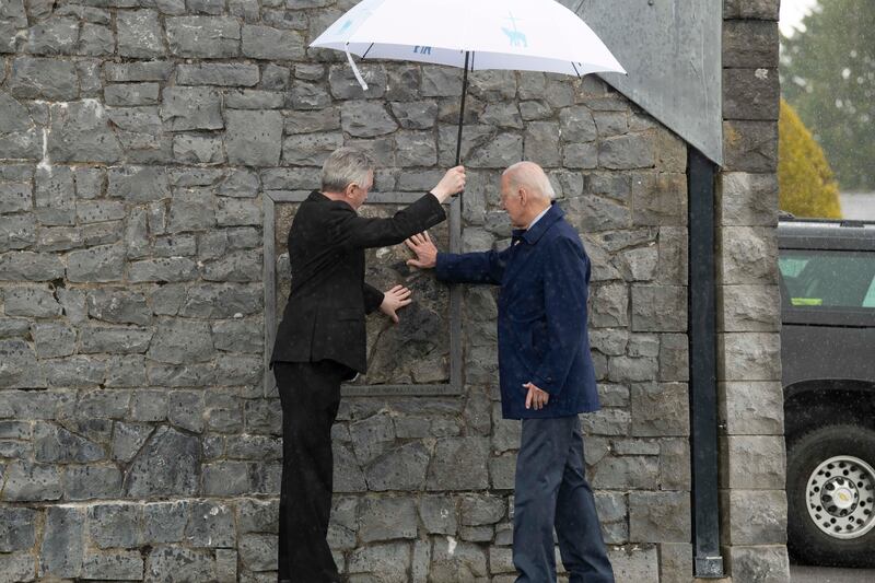 Joe Biden at Knock Shrine and Basilica with Fr Richard Gibbons, where he touched part of the gable wall of the original church where the apparition of Virgin Mary is said to have happened. Photograph: Julien Behal/Irish Government/Getty