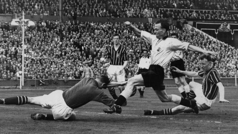 Manchester City goalkeeper Bert Trautmann unknowingly breaks his neck in the FA Cup final in 1956. Photograph: Allsport Hulton/Archive