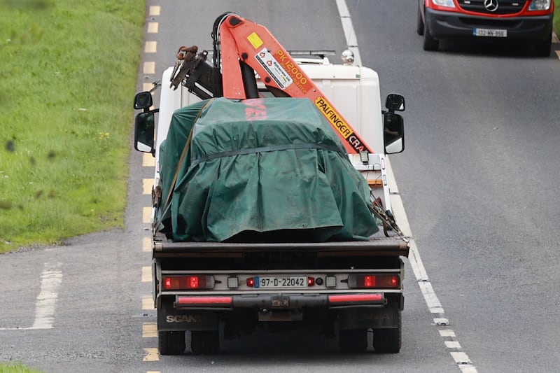 The scene on the N54 Clones to Smithborough road at Legnakelly, Co. Monaghan, as a vehicle is removed after two teenagers were killed. Photograph: Liam McBurney/PA Wire 
