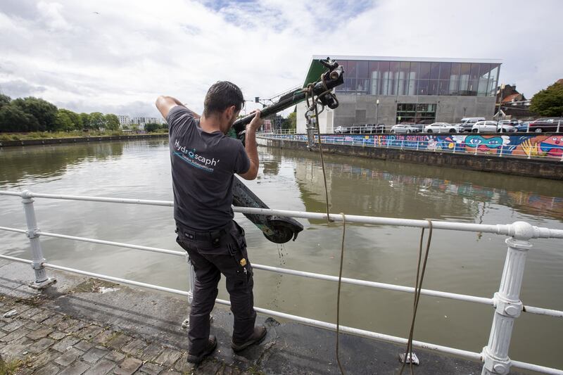 An e-scooter is retrieved from a canal in Brussels. Photograph: Nicolas Maeterlinck/AFP via Getty