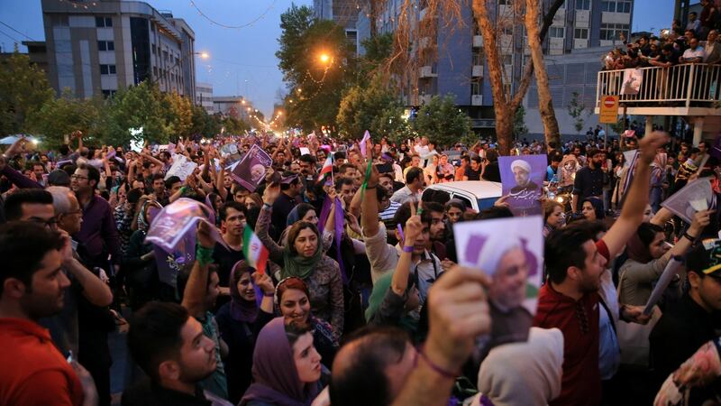 Supporters of Iranian president Hassan Rouhani  celebrate his re-election, in Tehran. Photograph: Tima via Reuters