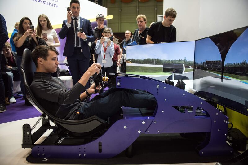 McLaren Formula One driver Lando Norris drives on a racing simulator at the Autosport International show in Birmingham in 2019. Photograph: Oli Scarff/AFP via Getty Images