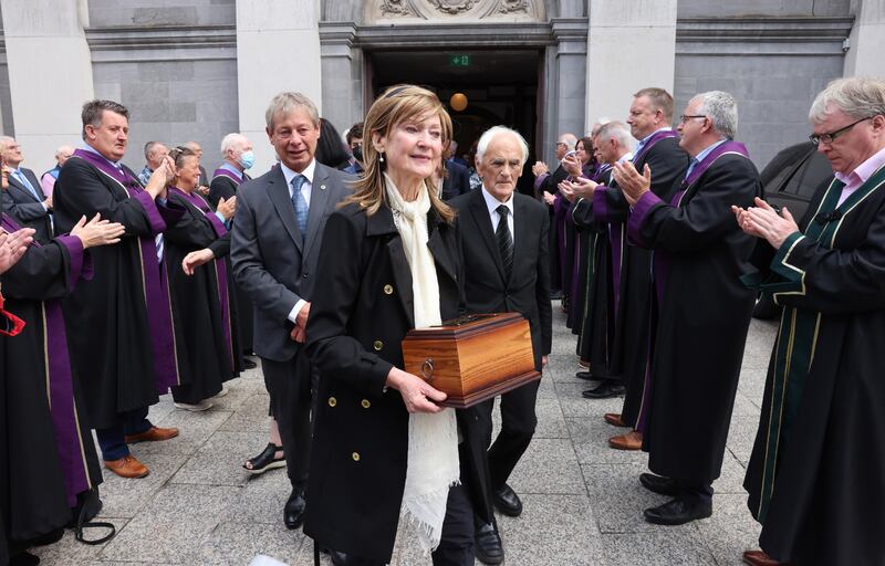 Stella Bowyer and Brendan Bowyer jnr (left) following the memorial service for showband singer Brendan Bowyer, in the Cathedral of the Most Holy Trinity Within, in Waterford city. Photograph: Dara Mac Dónaill 










