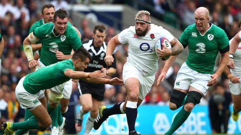 Joe Marler of England hands off Ireland's Conor Murray during a World Cup warm-up game  at Twickenham. Photograph: Clive Rose/Getty Images