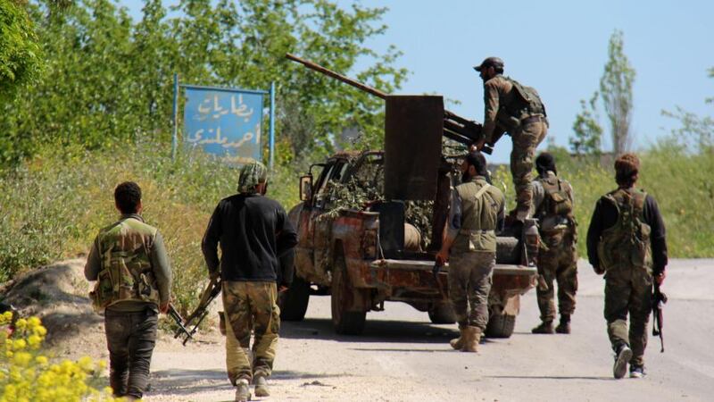 A file image showing armed rebel fighters  in the northern Syrian town of Jisr al-Shughur in April. Photograph: AFP