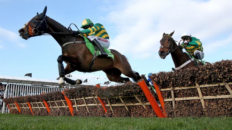 Jezki ridden by Barry Geraghty jumps ahead of My Tent Or Yours ridden by Tony  McCoy to win the 2014  Champion Hurdle at Cheltenham. Photograph: Dan Sheridan/Inpho