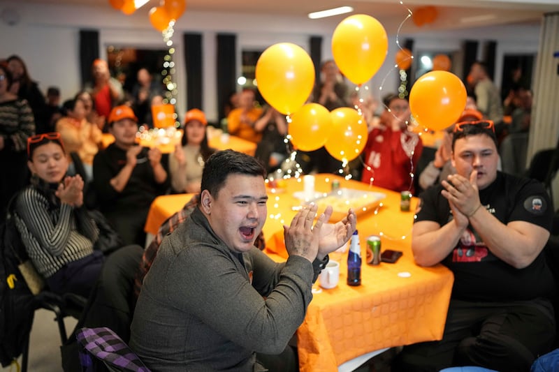 Members of the Naleraq party applaud during an event after parliamentary elections in Nuuk, Greenland. Photograph: Evgeniy Maloletka/AP