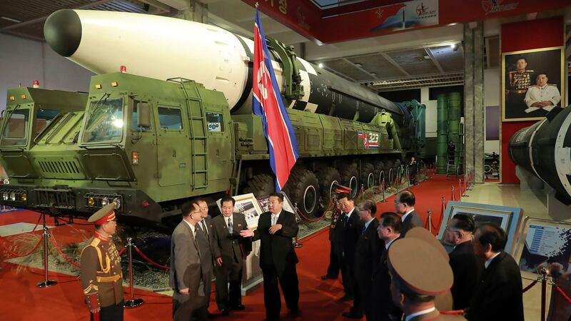 In this photo provided by the North Korean government, North Korean leader Kim Jong Un, centre, speaks in front of what the North says an intercontinental ballistic missile displayed at an exhibition of weapons systems in Pyongyang, North Korea last week. Photograph: AP