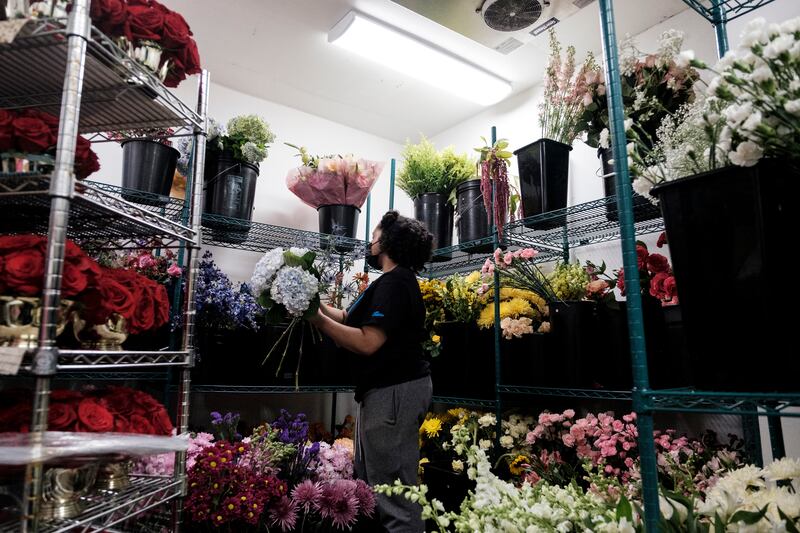 Terra Preston working at Lee’s Flower and Card Shop in Washington. The owner of the shop predicted that flowers would be one of the first expenses eliminated from federal workers’ budgets. Photograph: Michael A McCoy/New York Times
                      