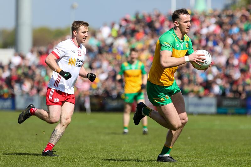 Donegal's Jason McGee gets away from Tyrone's Michael O'Neill. McGee forms a formidable midfield pairing with Michael Langan Photograph: Lorcan Doherty/Inpho 