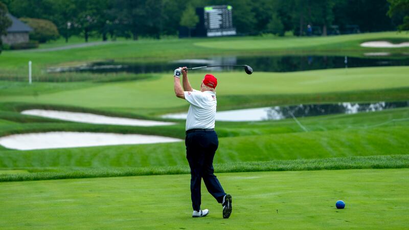 Former US president Donald Trump playing golf. Photograph: Doug Mills/New York Times