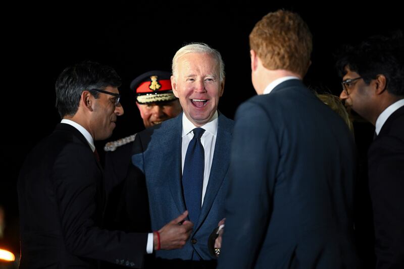 US president Joe Biden with US special envoy for Northern Ireland Joe Kennedy, as he is greeted by British prime minister Rishi Sunak (left) at Belfast International Airport in Belfast last night. Photograph: Kenny Holston/The New York Times