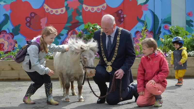 Lord Mayor of Dublin Nial Ring with Moses, the 17-year-old miniature pony, and  Ella and Lynn Spitzer Beirne on the opening day of Dublin City Council’s first urban farm. Photograph: Alan Betson / The Irish Times