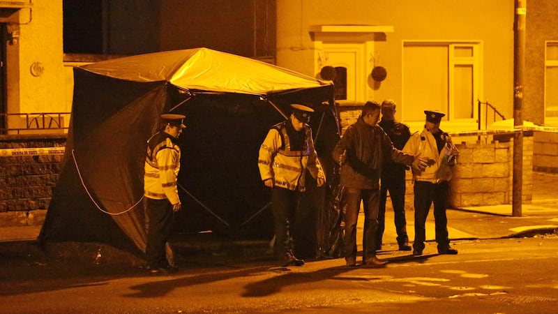 Gardaí at the scene of a shooting on Killala Road, in Dublin 7 on Sunday evening. David Douglas received a number of gunshot wounds to his body during the attack. Photograph: Collins