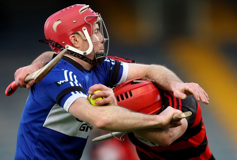 Sarsfields’ Daniel Kearney battles with Ronan Power of Ballygunner during the Munster final at Thurles. Photograph: James Crombie/Inpho 