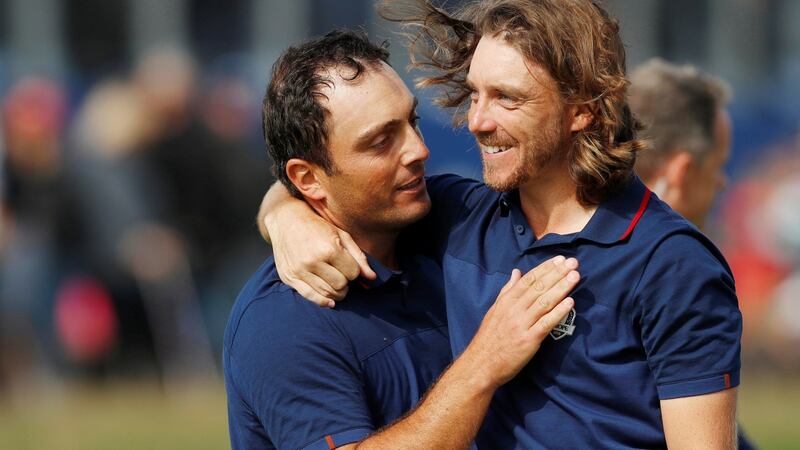 Francesco Molinari and Tommy Fleetwood celebrate after winning their morning fourballs match at the Ryder Cup at Le Golf National in Paris. Photograph: Paul Childs/Reuters