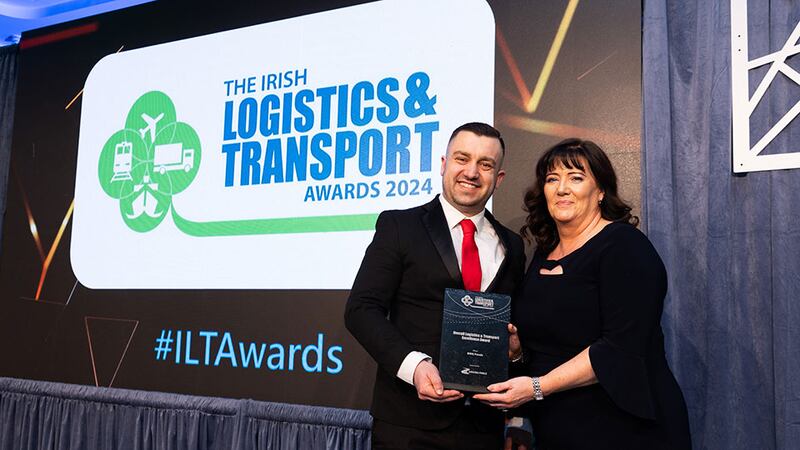 Adam Zurawski, transport & logistics recruitment manager, Driving Force presents the award, overall logistics & transport excellence award to Joanne Mellon, BWG Foods