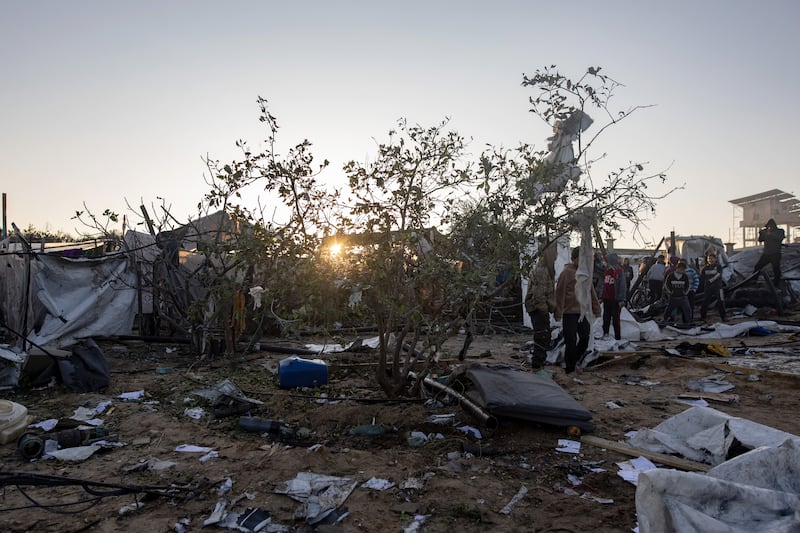 People inspect damage after an Israeli air strike targeted an internally displaced persons camp in Al-Mawasi area, west of Khan Yunis. Photograph: Haitham Imad/Shutterstock/EPA-EFE